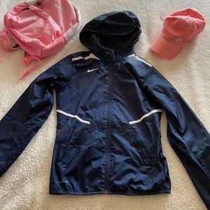 Brand new Nike storm fit navy jacket with zippered hoodie pouch